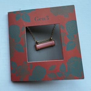 Gold chain necklace with pink centre stone